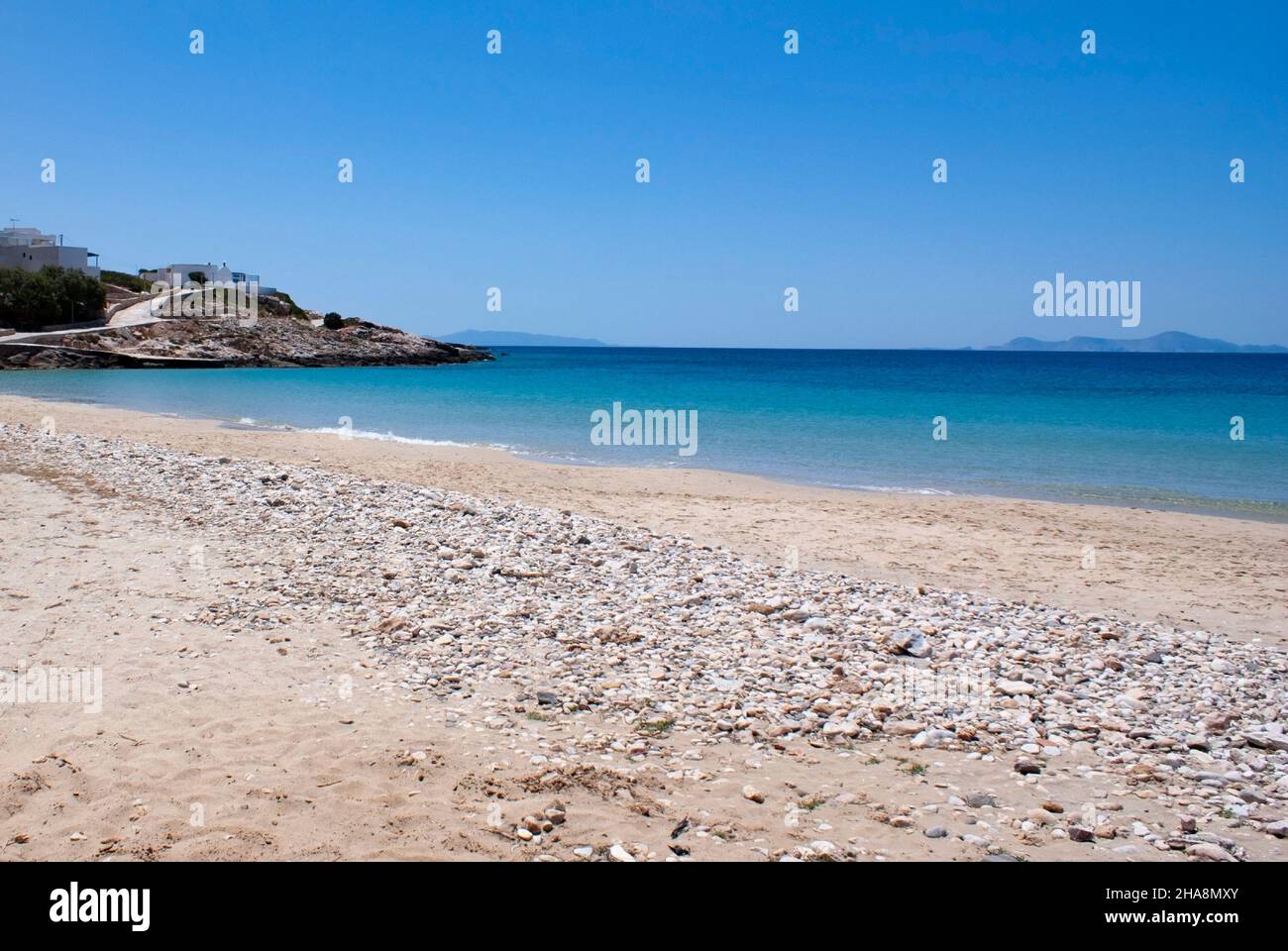 Beautiful sandy beach, Donousa island, Cyclades, Greece. A secluded destination with soft sand on a summer day.  Landscape aspect shot. Stock Photo