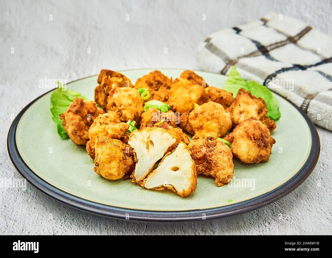 Vegan cauliflower buffalo wings on white background.Tasty vegetarian