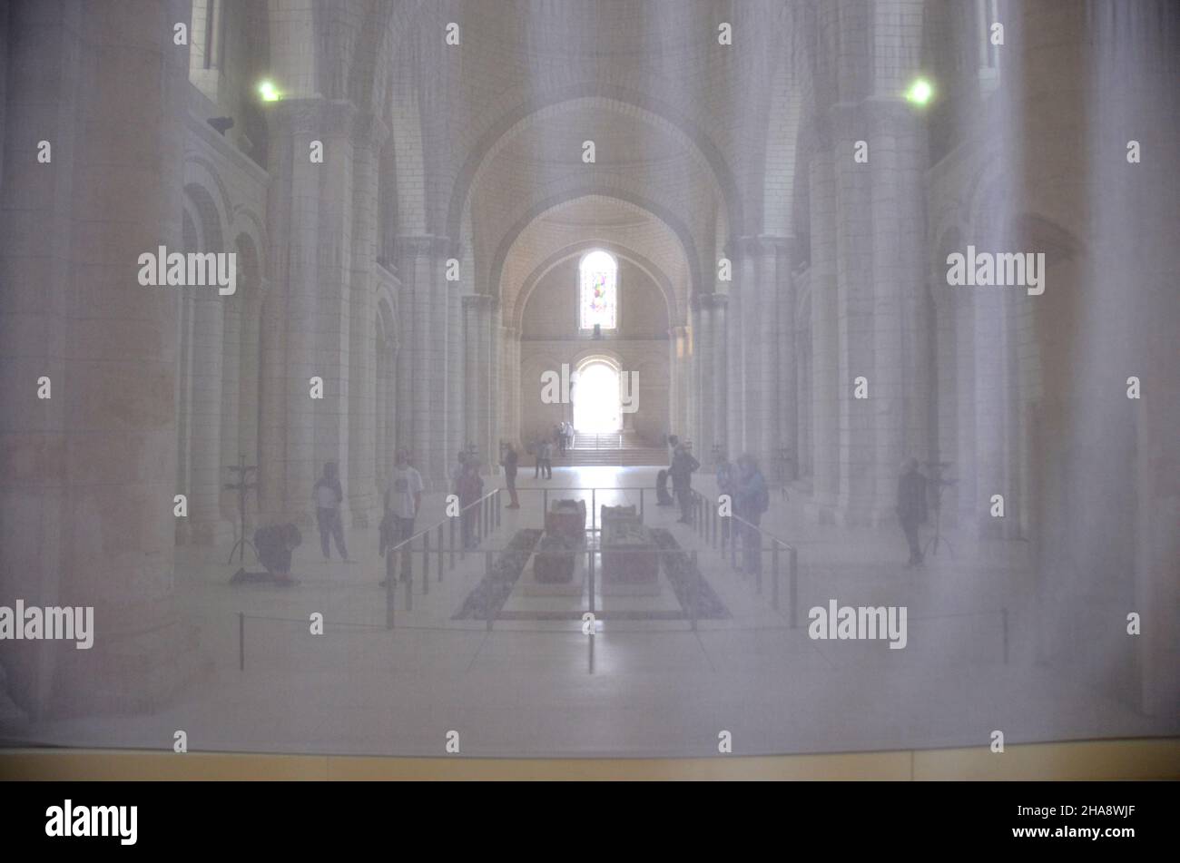 Inside the abbey of Fontervraud, Loire valley. It is a masterpiece of the middle age architecture. Picture taken behind a light curtain. Stock Photo