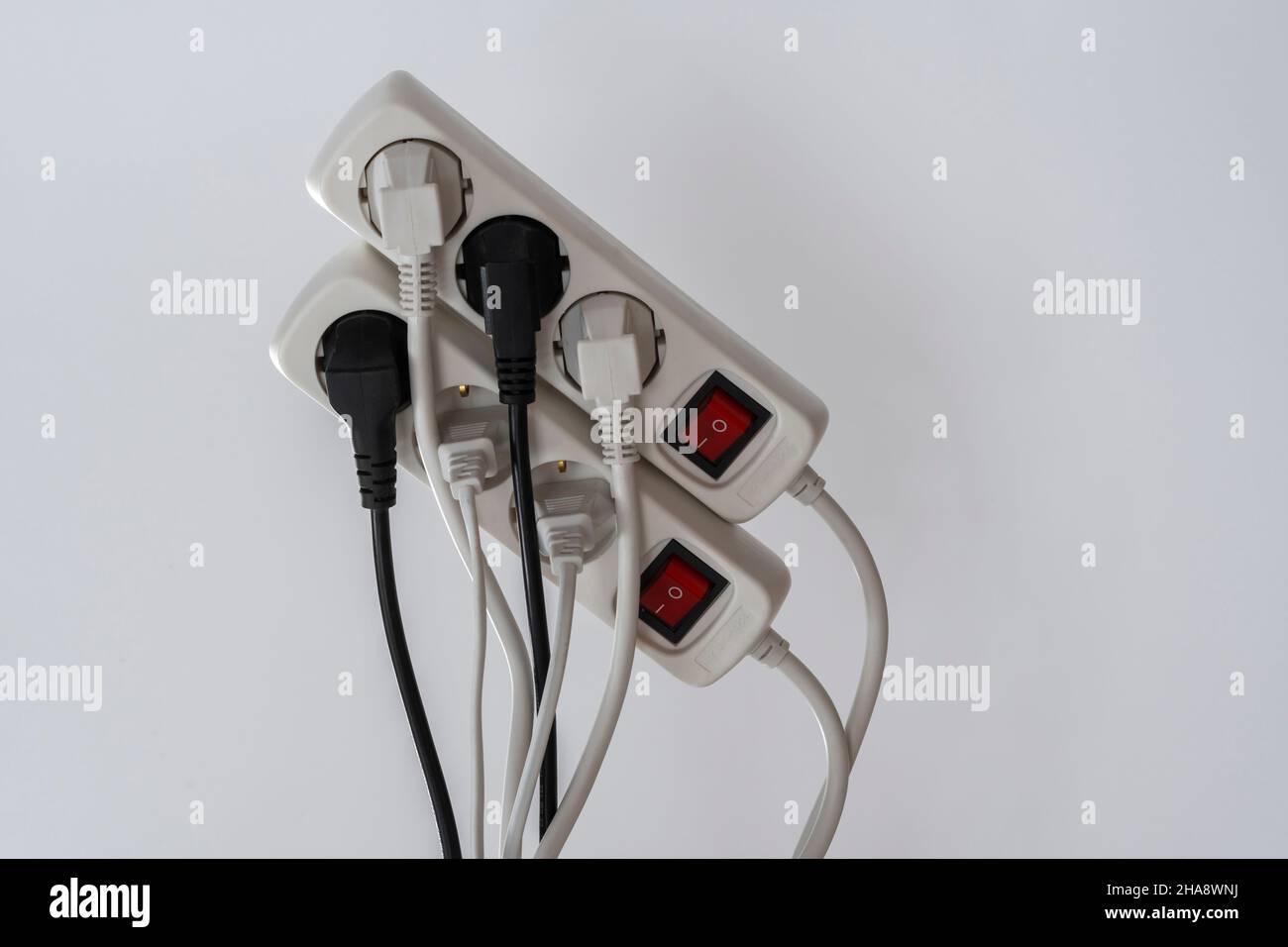 Wires plugged into power bar Stock Photo