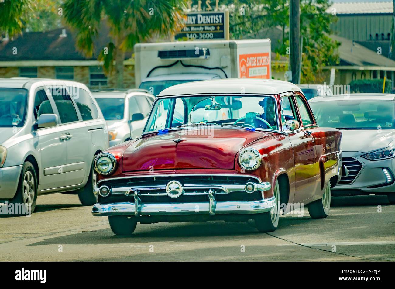 A man drives a 1954 Ford Crestline down Barataria Boulevard, Dec. 9