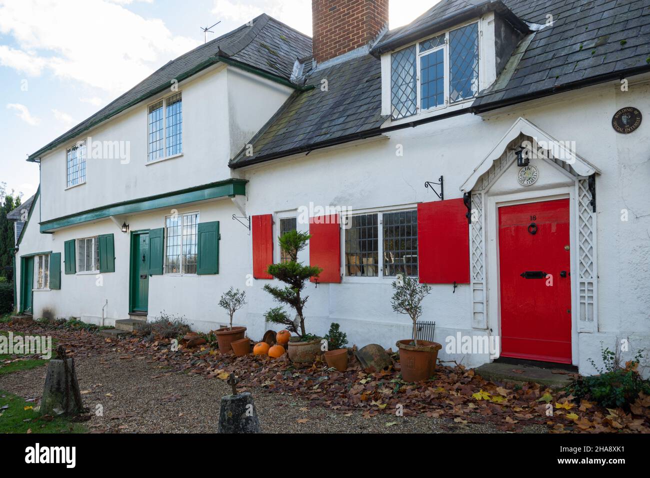 16 and 18, The Street, Shalford, Surrey, England, UK. Grade II Listed Building, 17th century cottages with colourful doors and shutters in the village Stock Photo
