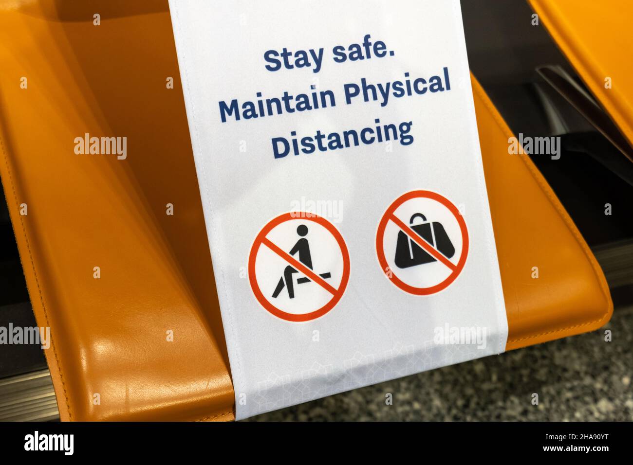 social distancing warning sign in airport due to COVID 19 coronavirus pandemic. Stock Photo