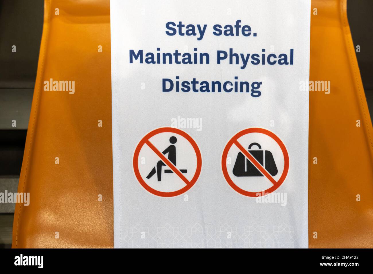 social distancing warning sign in airport due to COVID 19 coronavirus pandemic. Stock Photo