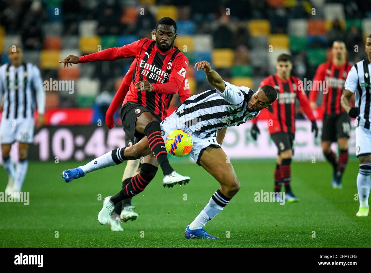 Udine, Italy. 11th Dec, 2021. Milan's Fikayo Tomori (Milan) in action against Udinese's Norberto Bercique Gomes Betuncal during Udinese Calcio vs AC Milan, italian soccer Serie A match in Udine, Italy, December 11 2021 Credit: Independent Photo Agency/Alamy Live News Stock Photo