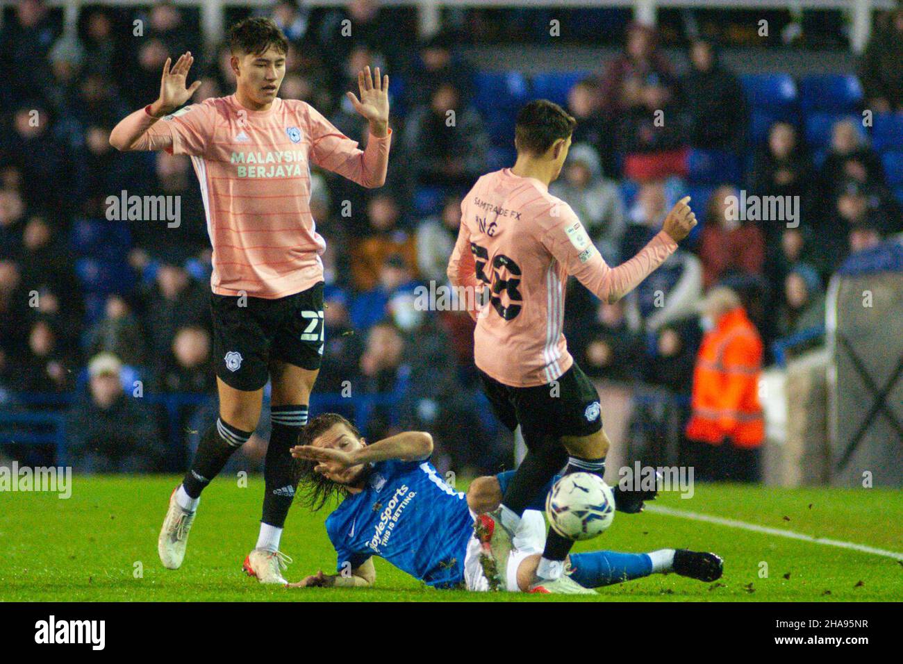 Ivan Sunjic (Birmingham no. 34 ) tackles Perry Ng (Cardiff no. 38 ) during the Sky Bet Championship match between Birmingham City and Cardiff City at St Andrews, Birmingham, England on 11 December 2021. Photo by Karl Newton/PRiME Media Images. Credit: PRiME Media Images/Alamy Live News Stock Photo