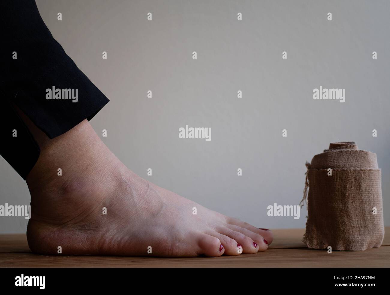 Concept of injury and treatment with a compression bandage roll and