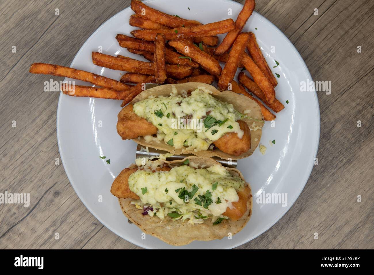 Overhead view of artistic presentation of crispy deep fried fish tacos
