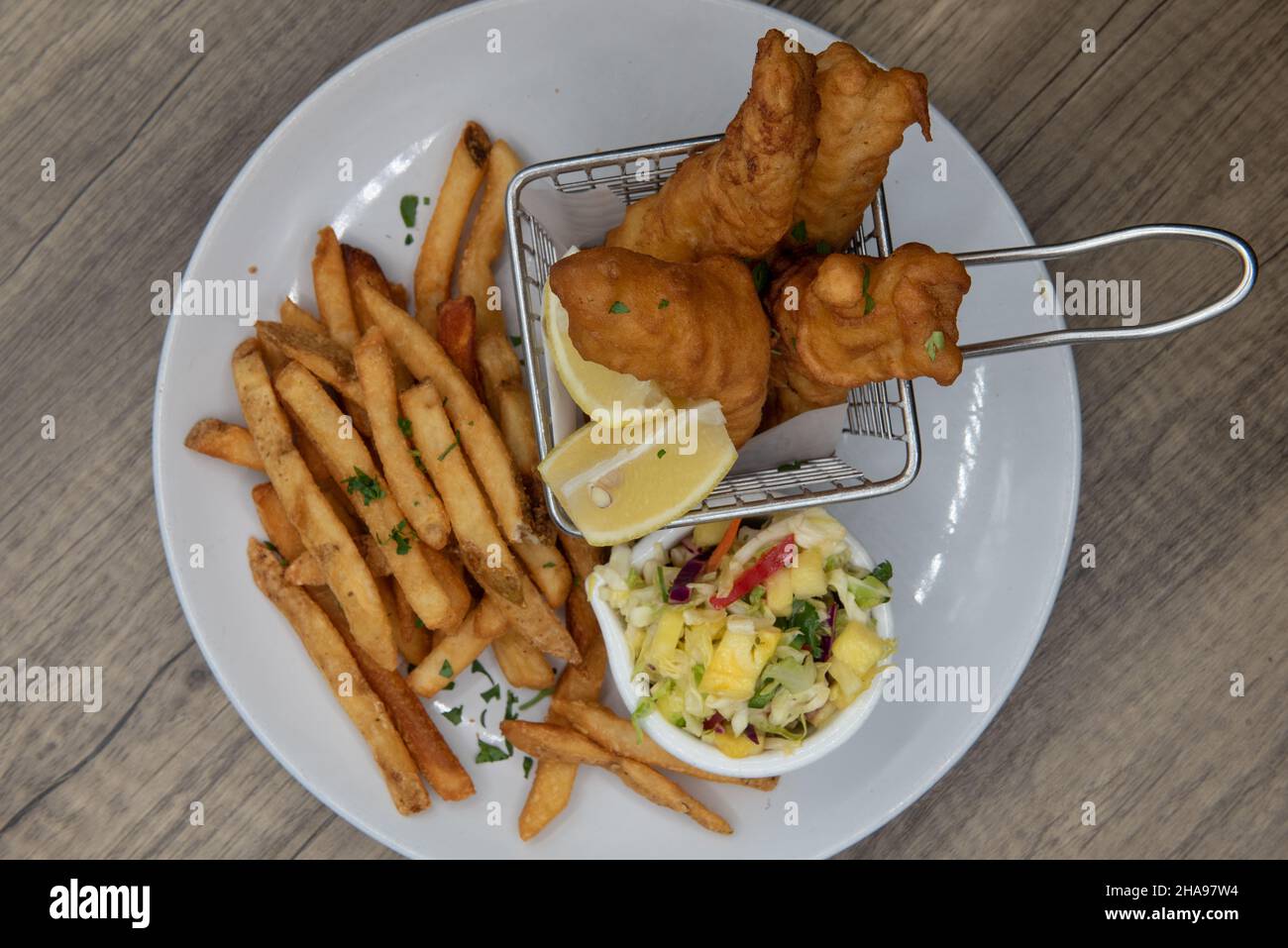 Overhead view of artistic presentation of deep fried fish and chips as