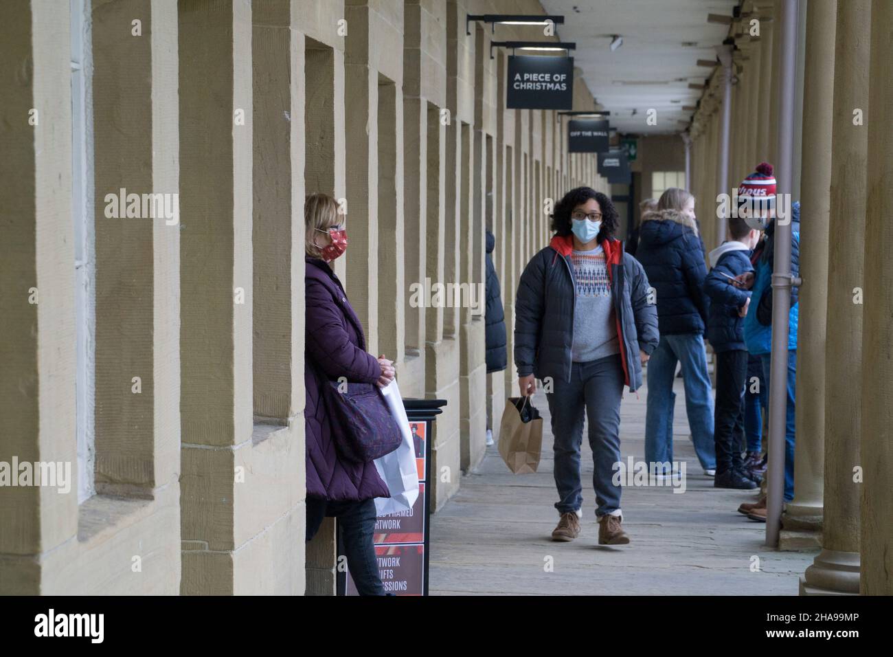 Halifax, UK, 11 December 2021: Christmas shoppers at the Piece Hall, which is home to many small, independent shops. Face masks are compulsory in enclosed areas and inside the shops as part of the government's Plan B measures to try to reduce the spread of the omicron variant of coronavirus. Anna Watson/Alamy Live News Stock Photo