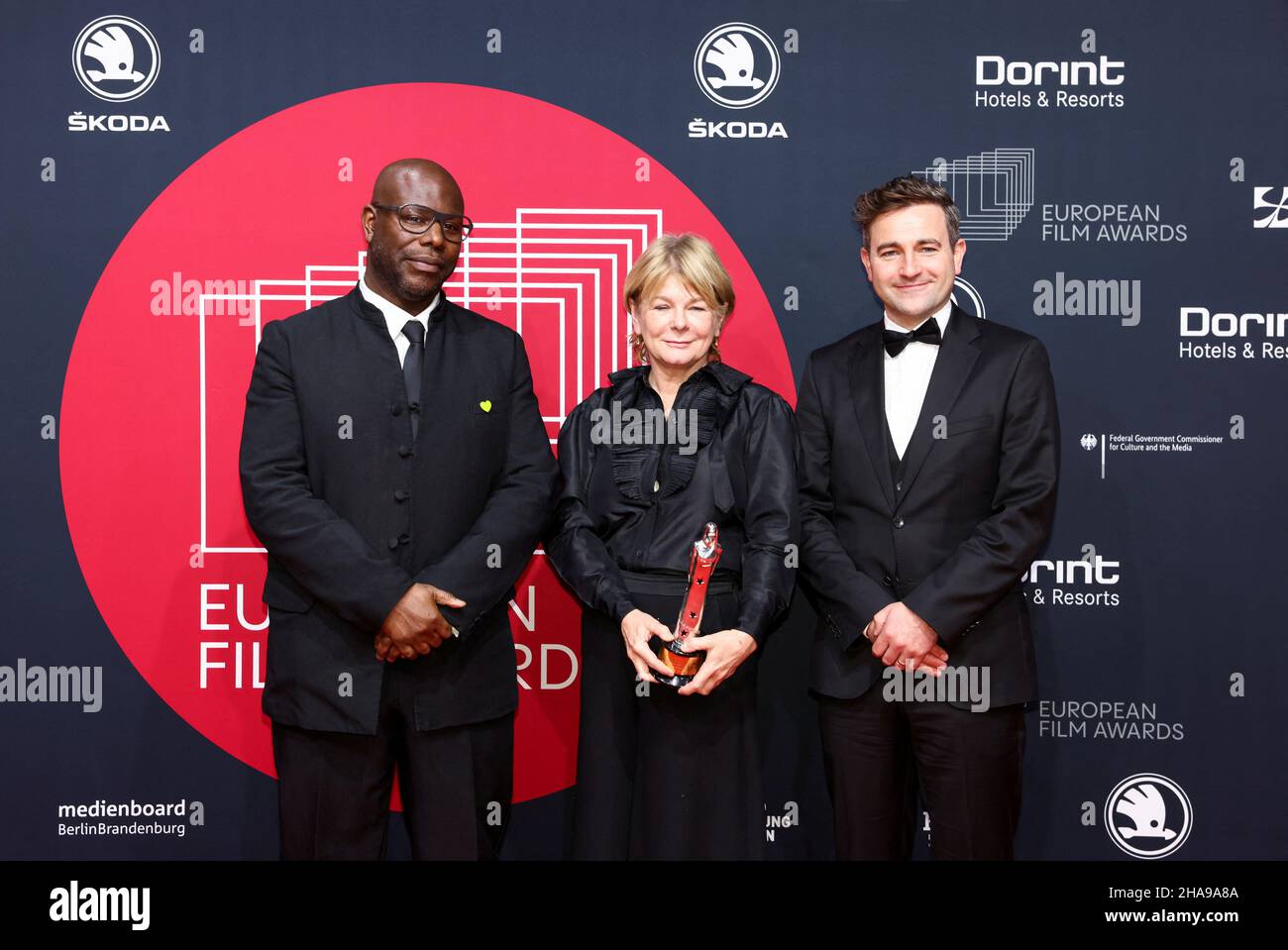 Berlin, Germany. 11th Dec, 2021. 'Small Axe' director Steve McQueen (l-r) and producers Tracey Scoffield and David Tanner at the 34th European Film Awards ceremony. The European Film Academy presents the awards in Berlin. Credit: Christian Mang/Reuters/Pool/dpa/Alamy Live News Stock Photo