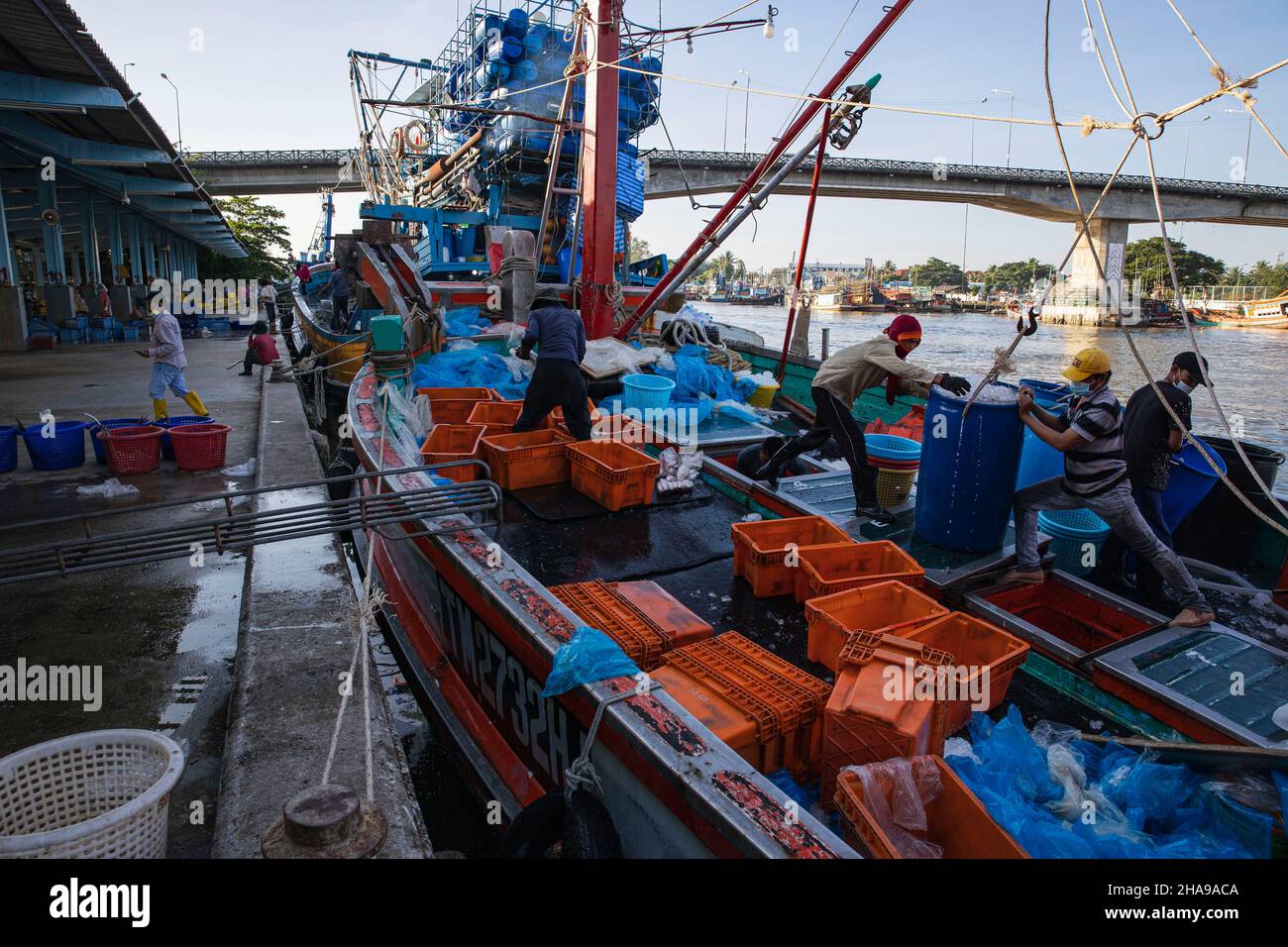 Fishing boat workers seen working on the fishing boat that anchored in