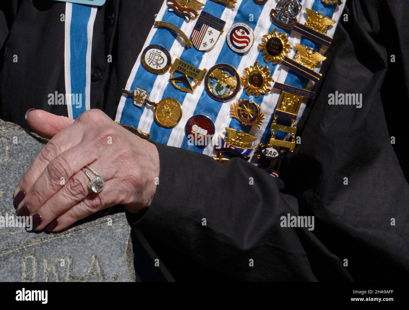 A member of the Daughters of the American Revolution wears her DAR pins
