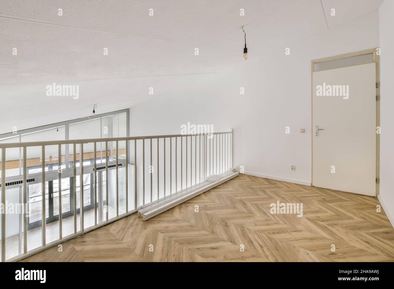 Interesting design of the balcony inside the house with parquet Stock ...