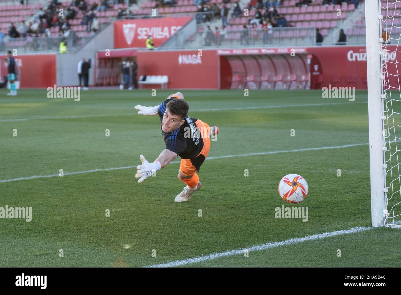 Luis López stopping a goal in the confrontation between Real Madrid Castilla and Sevilla Atlético on matchday 16 of the Primera Liga RFEF Group 2 in Seville, Spain. Credit: Alejandra Hidalgo/Alamy Live News Stock Photo