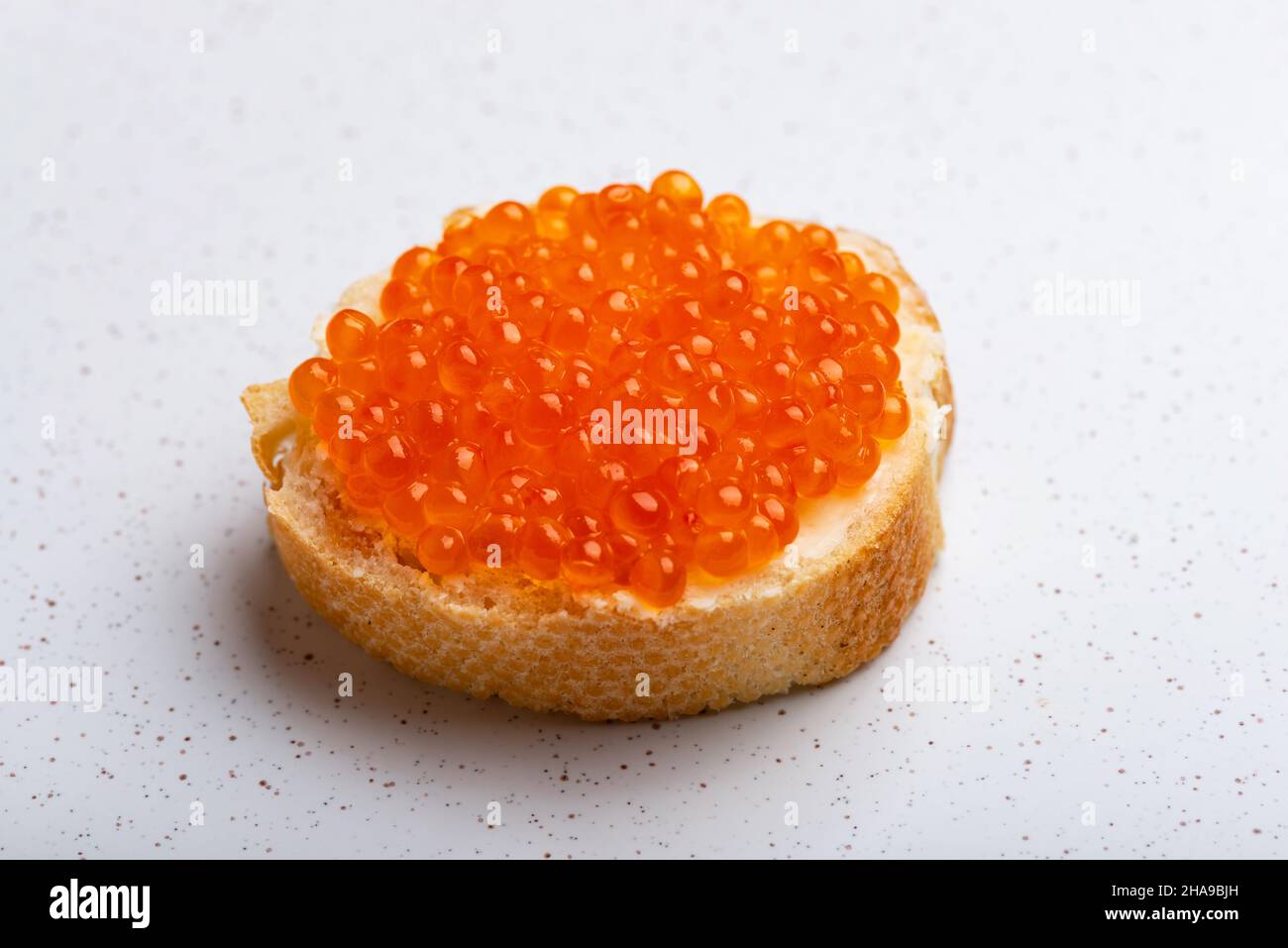 Sandwich with red caviar on whithe background Stock Photo