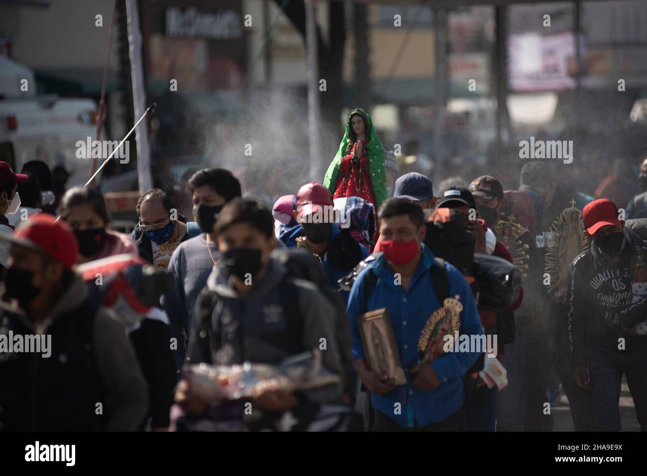 December 11, 2021 Health workers disinfect and sanitize the faithful