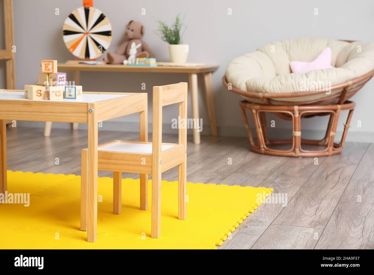 Interior of children's room with table and chair Stock Photo - Alamy