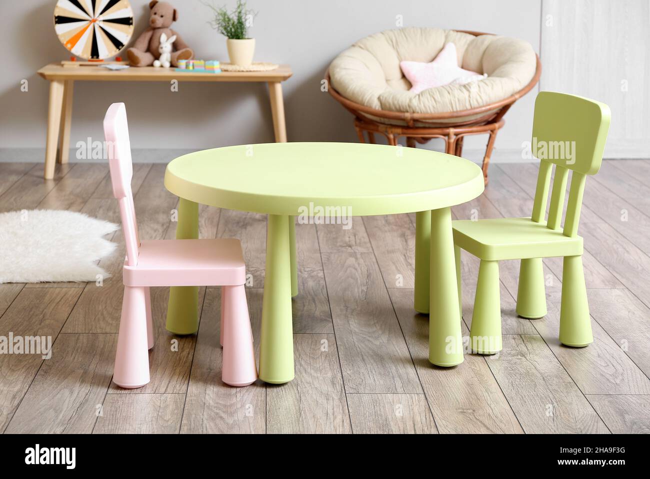 Interior of children's room with table and chairs Stock Photo - Alamy