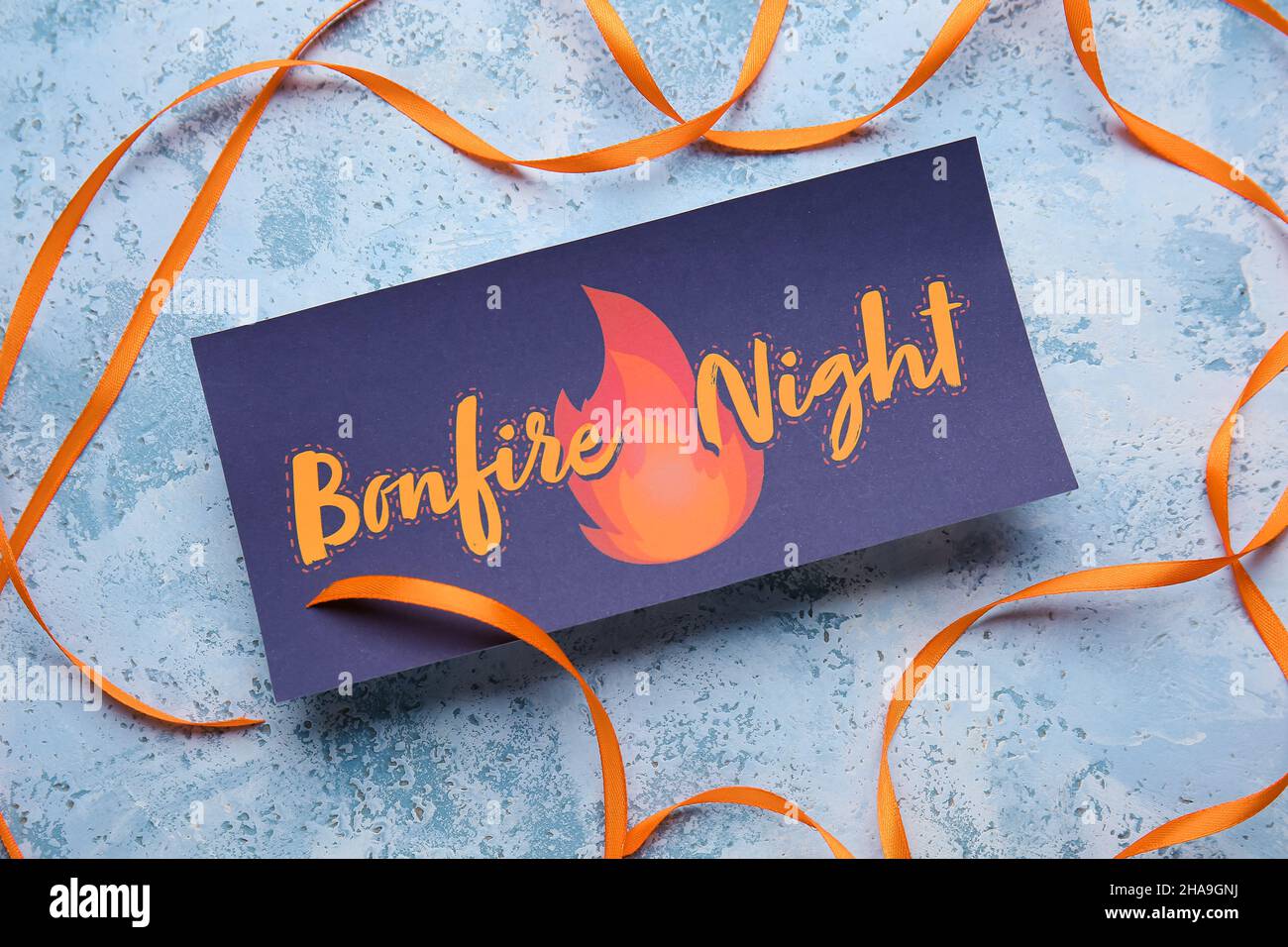 Greeting card for Guy Fawkes night and ribbon on color background Stock ...