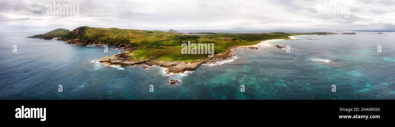 WIde aerial panorama of Broughton island chain of rocks and beaches off Australian pacific coast. Stock Photo