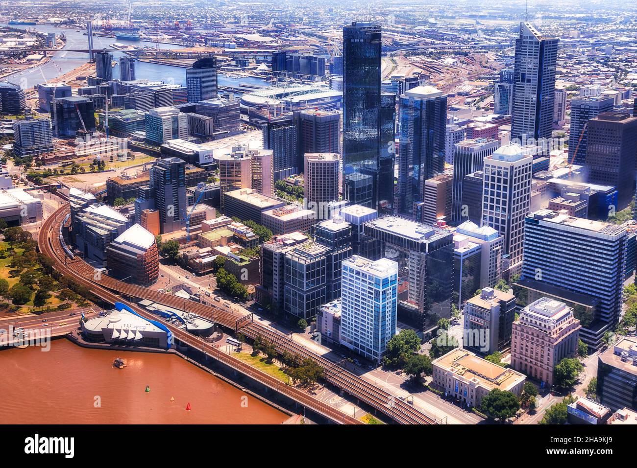 Shores of Yarra river in Melbourne city CBD - aerial view towards south city and docklands. Stock Photo