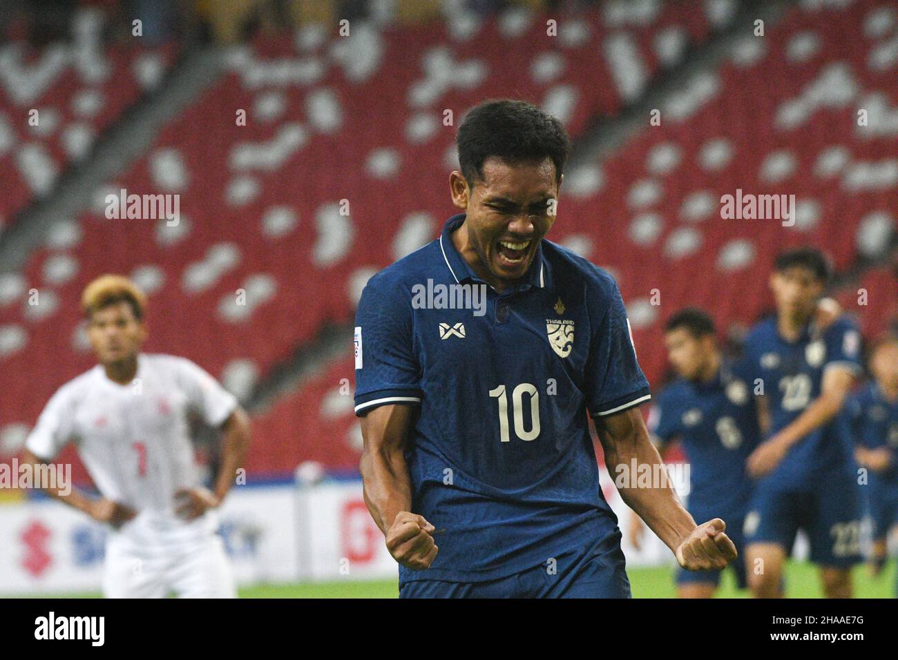 Singapore. 11th Dec, 2021. Teerasil Dangda of Thailand celebrates after  scoring during the ASEAN Football Federation (AFF) Suzuki Cup 2020 group A  match between Thailand and Myanmar at Singapore's National Stadium in