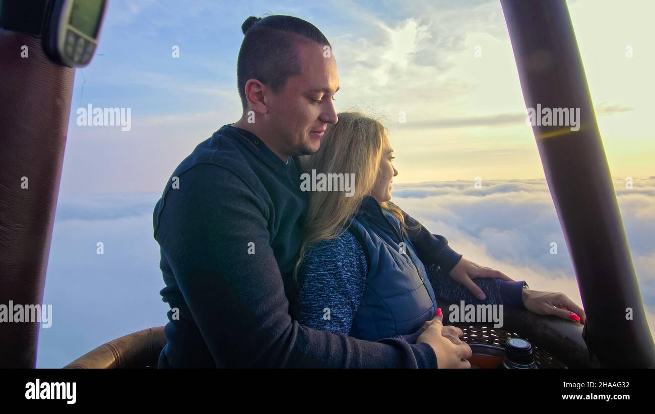 Adventure love couple on hot air balloon watermelon. Man and woman kiss ...