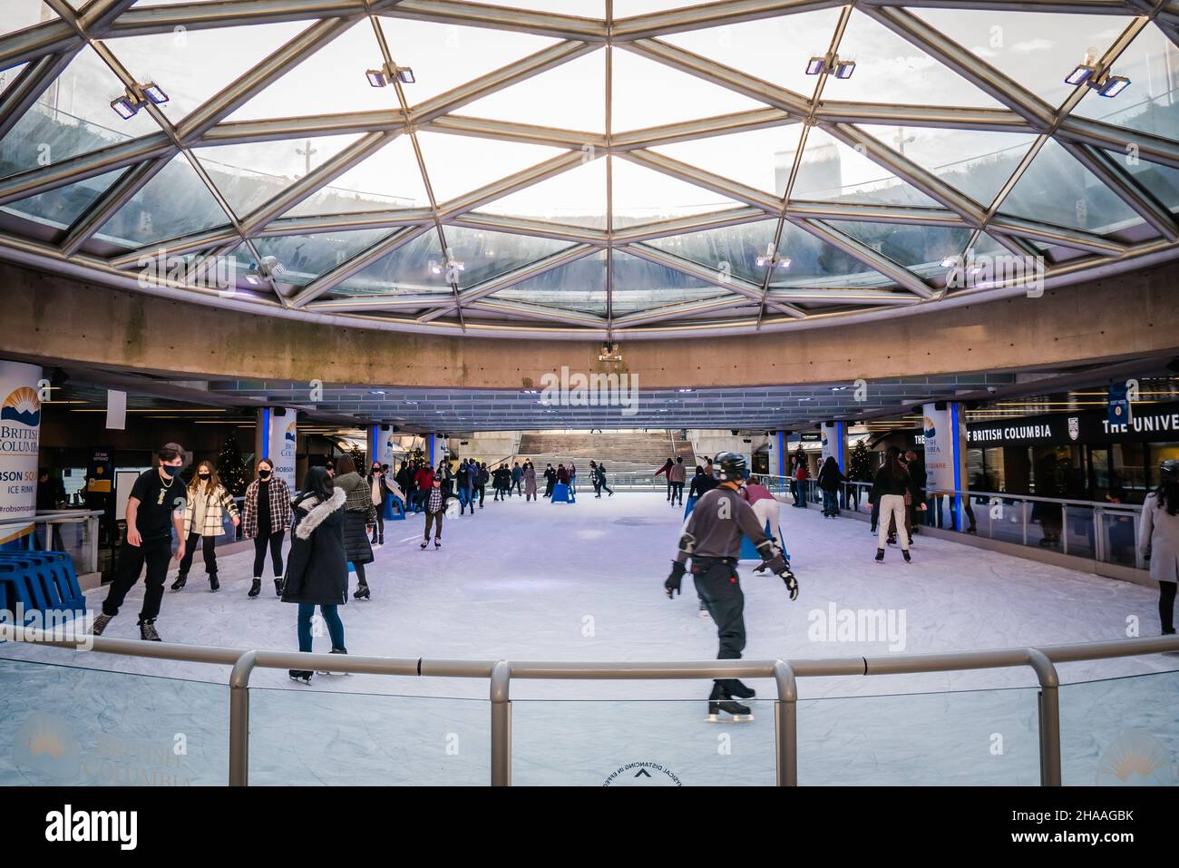 Robson Square Ice Rink is a free ice skating rink located in downtown vancouver during the winter Stock Photo