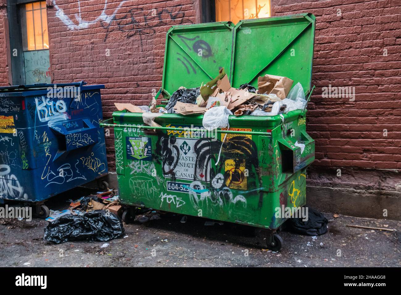 garbage in a dumpster back alley vancouver canada Stock Photo Alamy