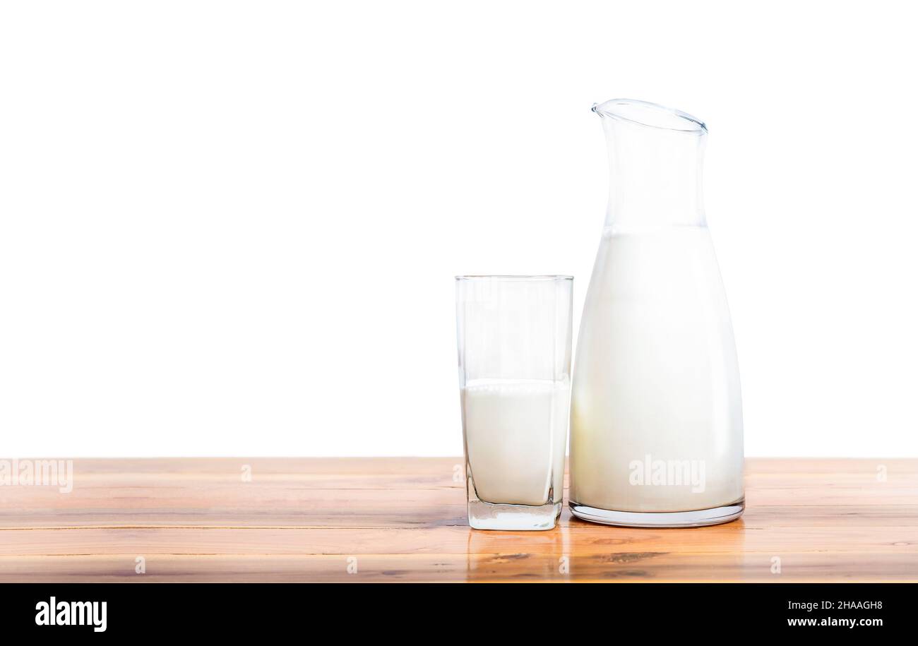 Fresh milk in glass and bottle on wooden table isolated on white background Stock Photo