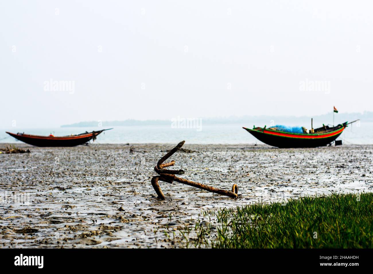 Native fishing boat has been anchored on beach Stock Photo