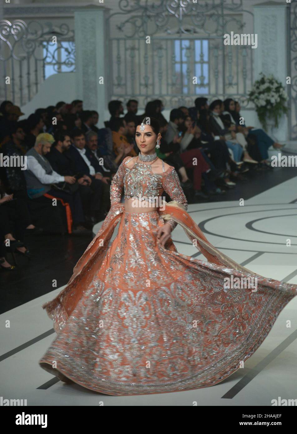 Lahore, Pakistan. 11th Dec, 2021. Pakistani model presents a creation by a  brand Fatima Salamat, Arooj Aziz, Rizwan Ahmed, Umsha by Uzma Babar, Edge  Republic, Mina Kashif, Humayun Alamgir during Pantene Hum