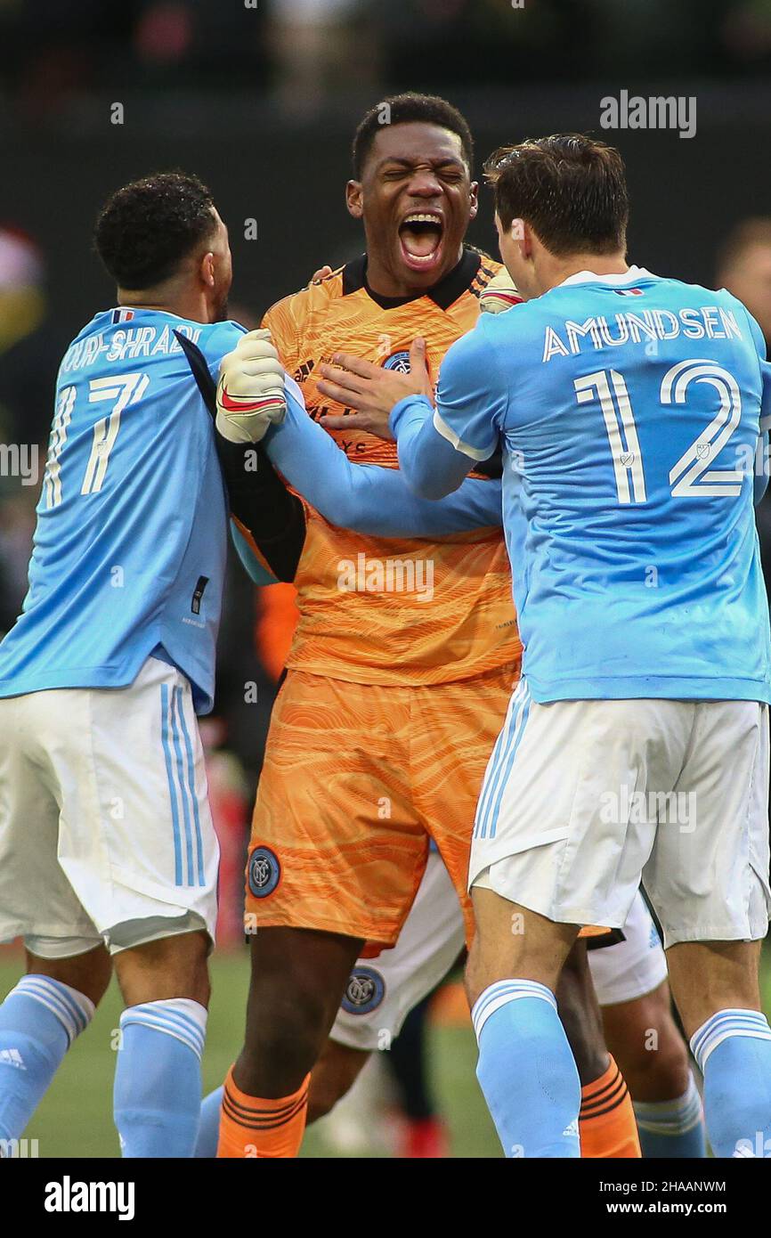 December 11, 2021: New York City FC defender Malte Amundsen (12), New York City FC goalie Sean Johnson (1), and New York City FC forward Ismael Tajouri-Shradi (17) celebrate after a game between the New York City FC and Portland Timbers at Providence Park in Portland, OR. New York City FC won 1-1 in penalty kicks to win the 2021 MLS Cup. Sean Brown/CSM Stock Photo