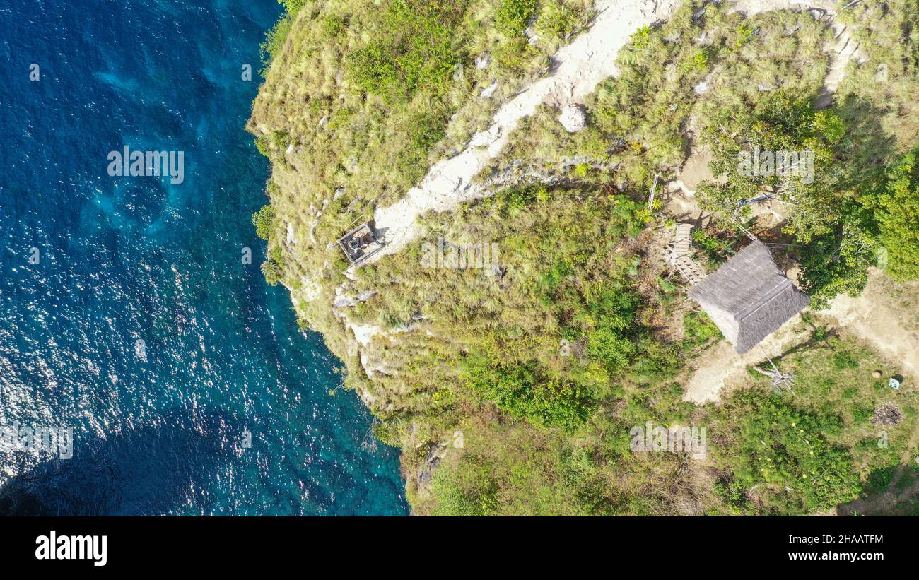 Aerial view of the small island of Nusa Batumategan from the Atuh Rija Lima shrine on Nusa Penida Island near Bali, Indonesia Stock Photo