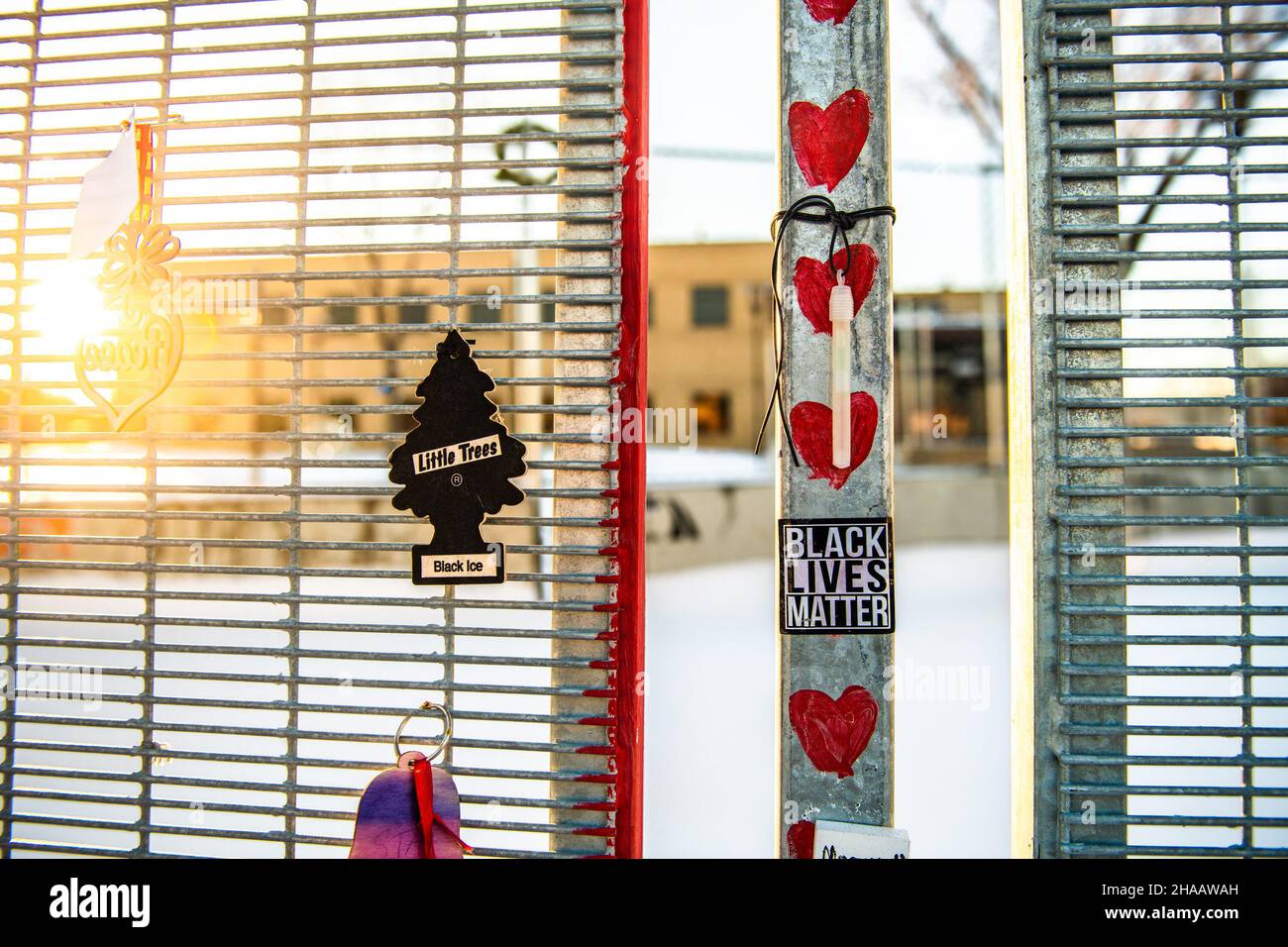 Little Trees air fresheners hang on the fence surrounding the Brooklyn