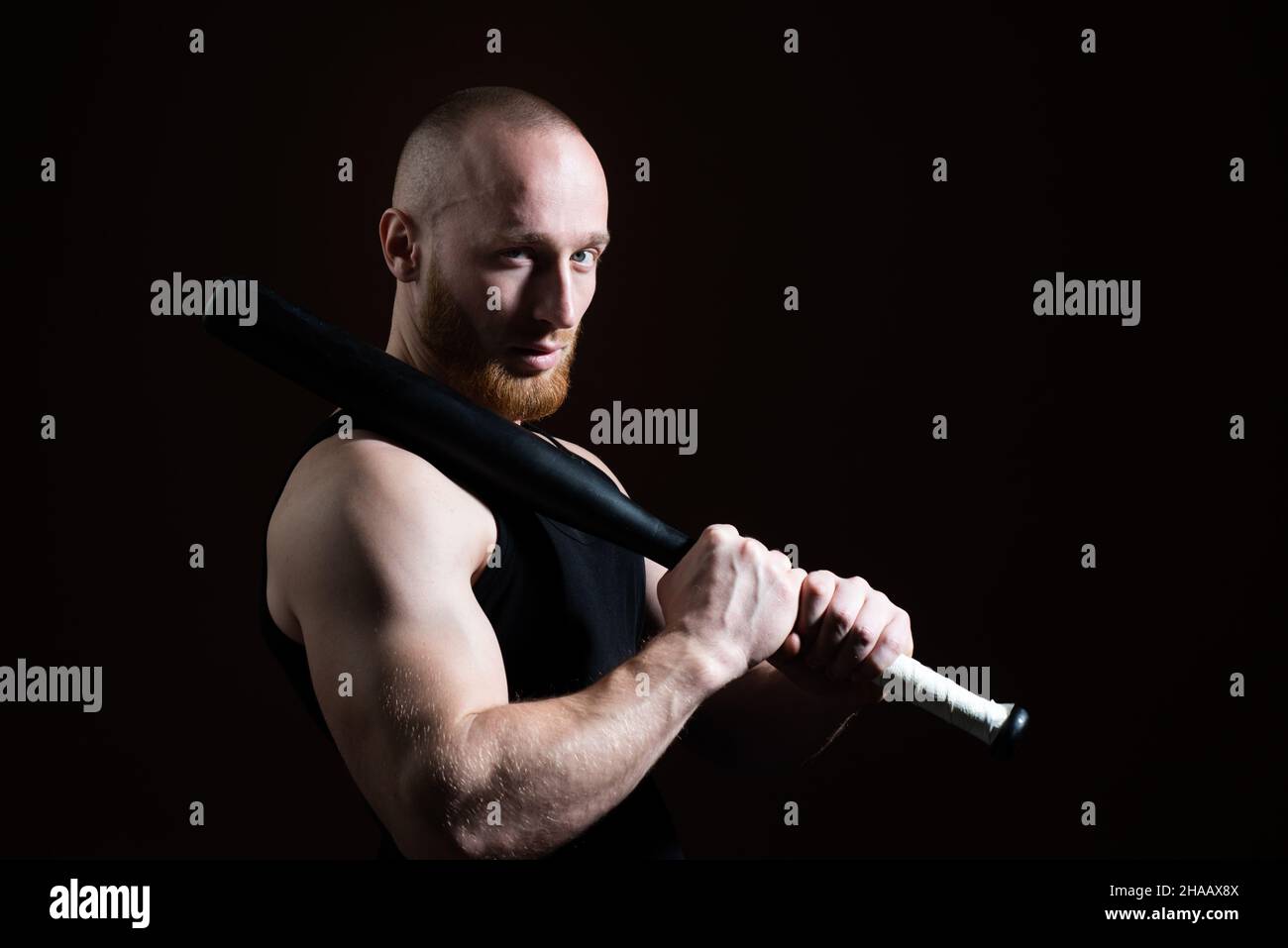 Brutal man with baseball bat for fighting, concept of men power and strong.  Dangerous man with serious emotion Stock Photo - Alamy