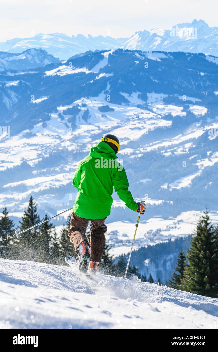 Skiing on perfectly groomed slopes in Vorarlberg, recreational pleasure and nature experience for everyone. Stock Photo