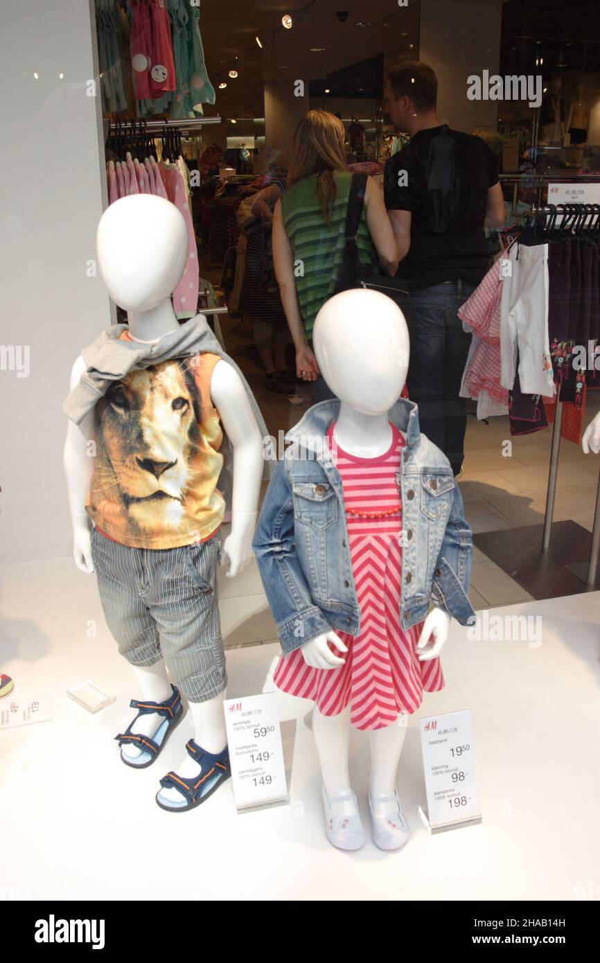 Child mannequins in shop window hi-res stock photography and