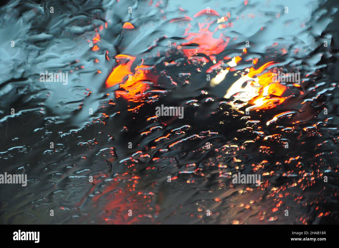 Heavy rain and rain drops on car windshield during rain, water droplets