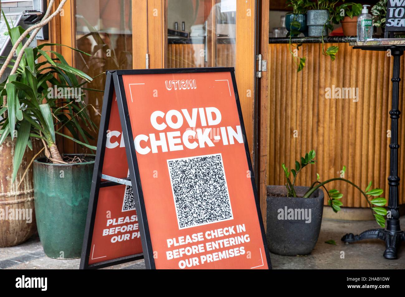 Covid 19 check in sign and service nsw app QR code outside a restaurant in Mnaly,Sydney,NSW,Australia Stock Photo