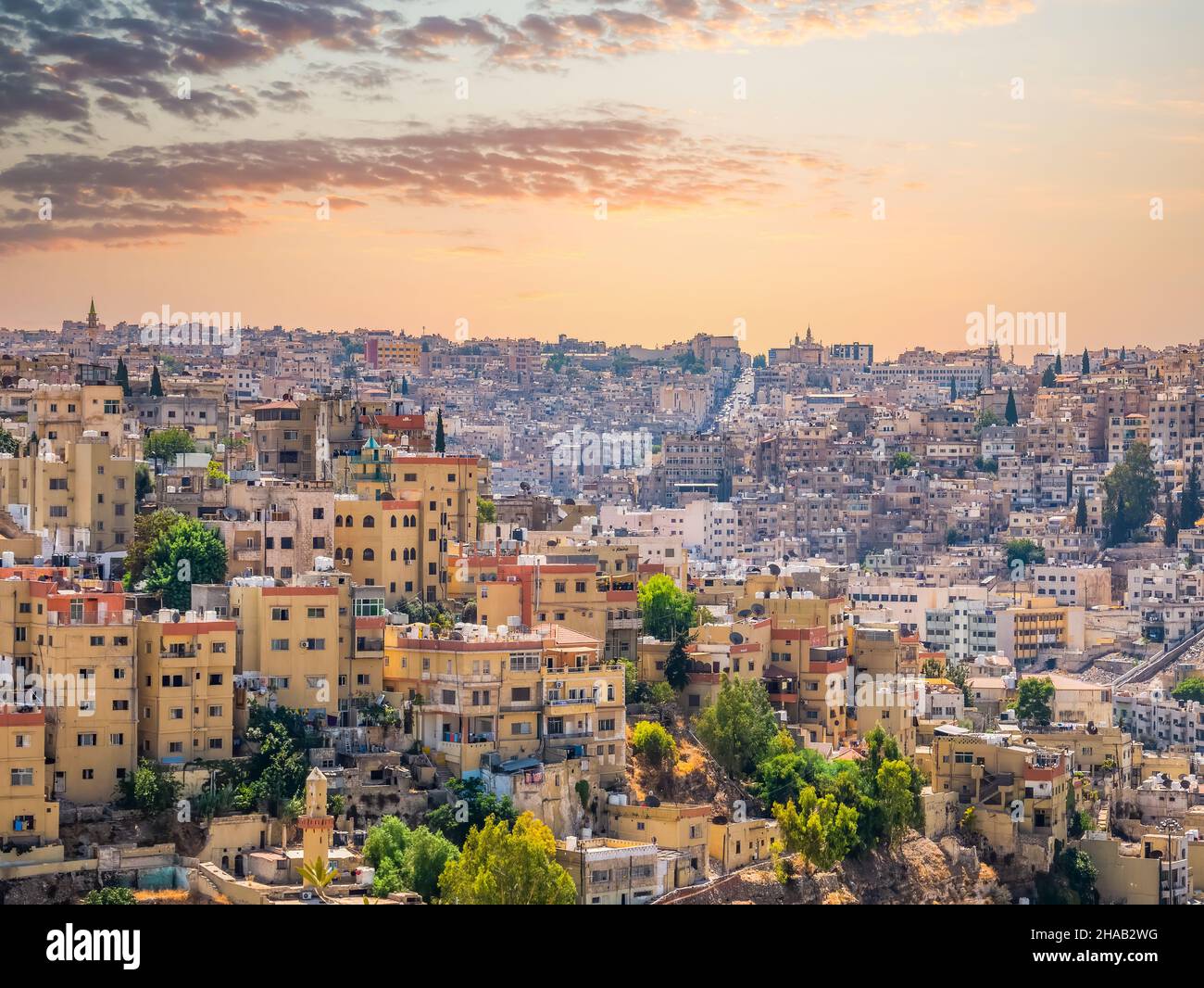 Beautiful view with many apartment buildings at sunset in Amman, Jordan