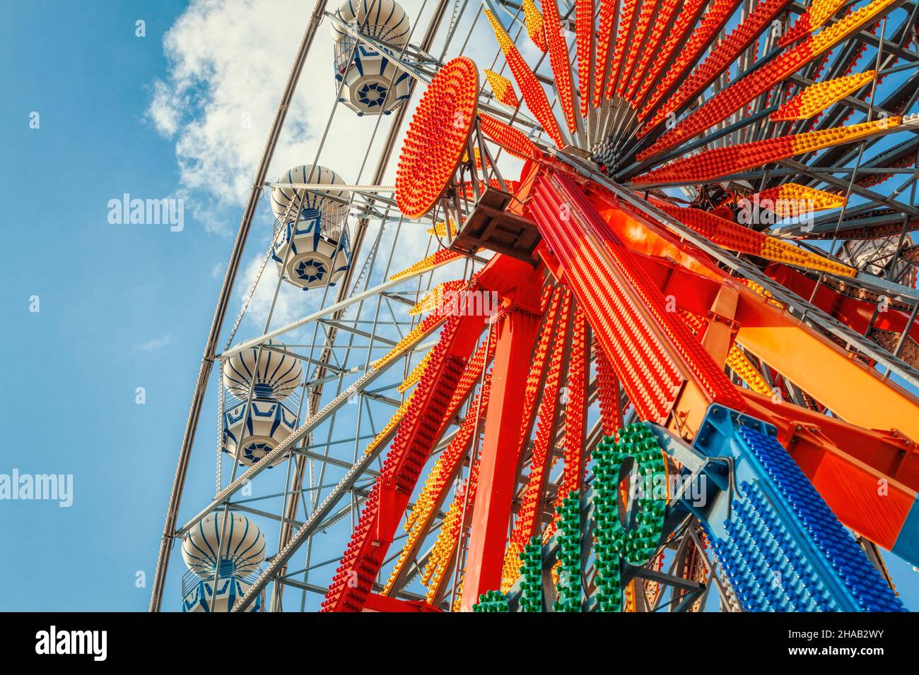 Colorful ferris wheel over blue sky. Stock Photo