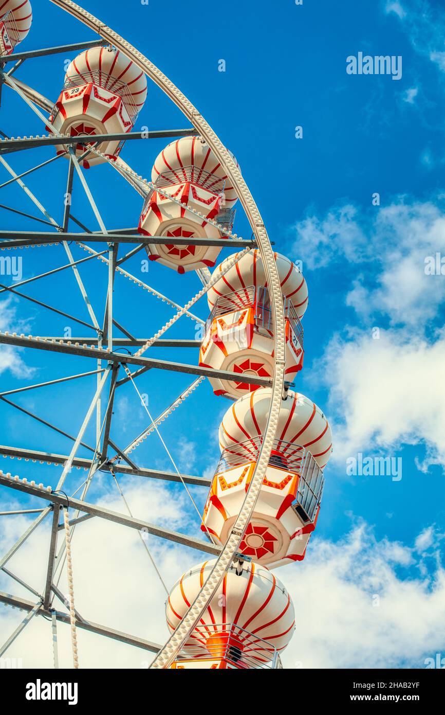 Colorful ferris wheel over blue sky. Stock Photo