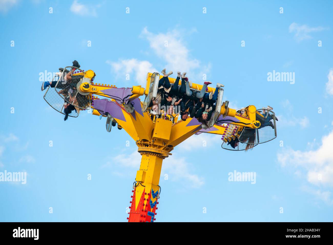Ankara-Turkey:October 3, 2021: Group of screaming people levitating and turning in the air on a thrilling attraction at luna park | Genclik Parki in A Stock Photo