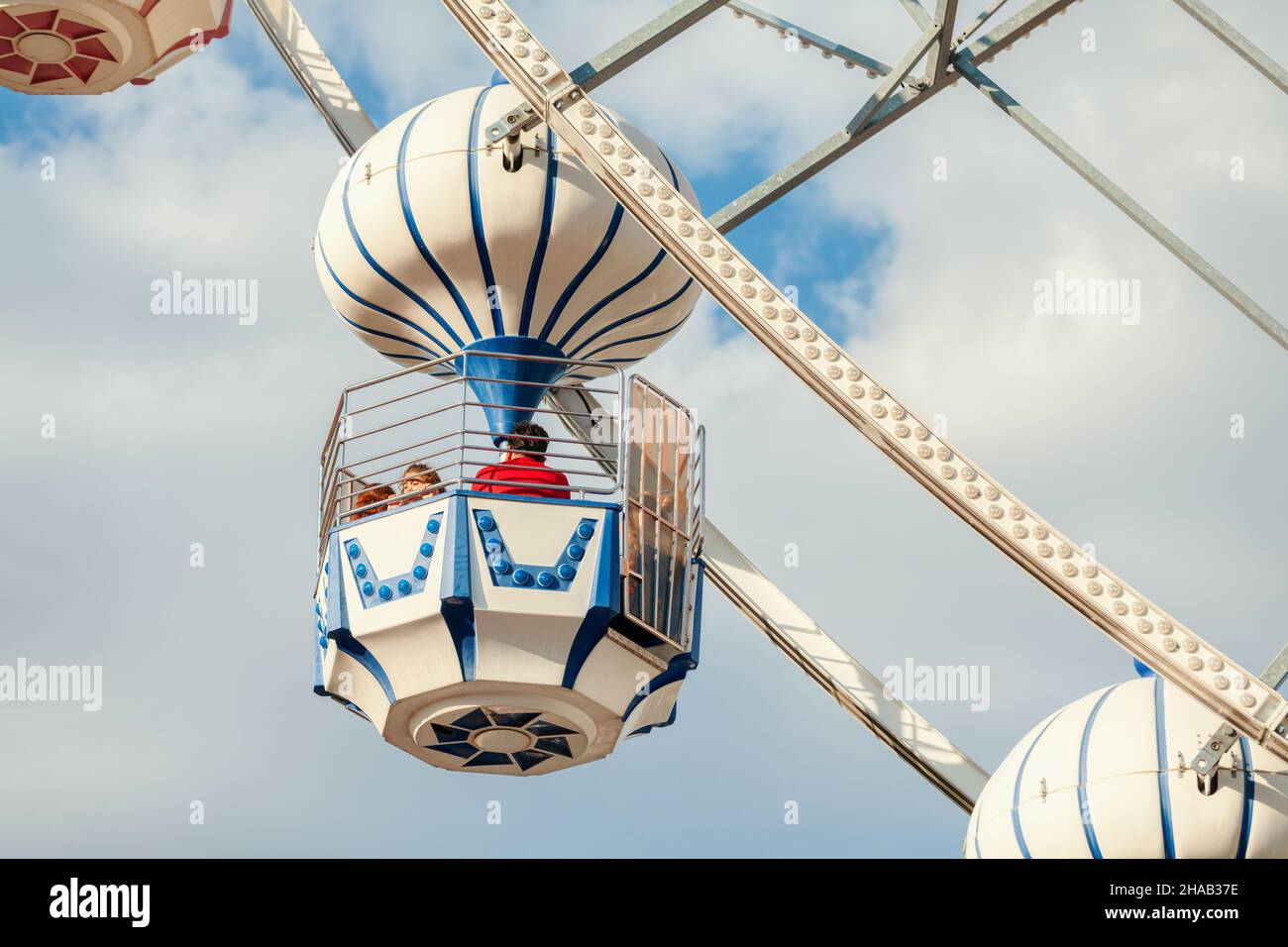 Ankara-Turkey:October 3, 2021: Happy excited cute little girl enjoying the view from ferris wheel in amusement park at luna park | Genclik Parki in An Stock Photo