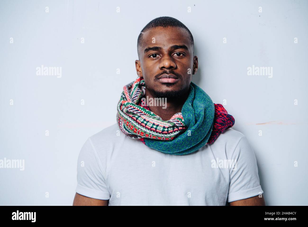 Head and shoulders portrait of an african american man over white wall ...