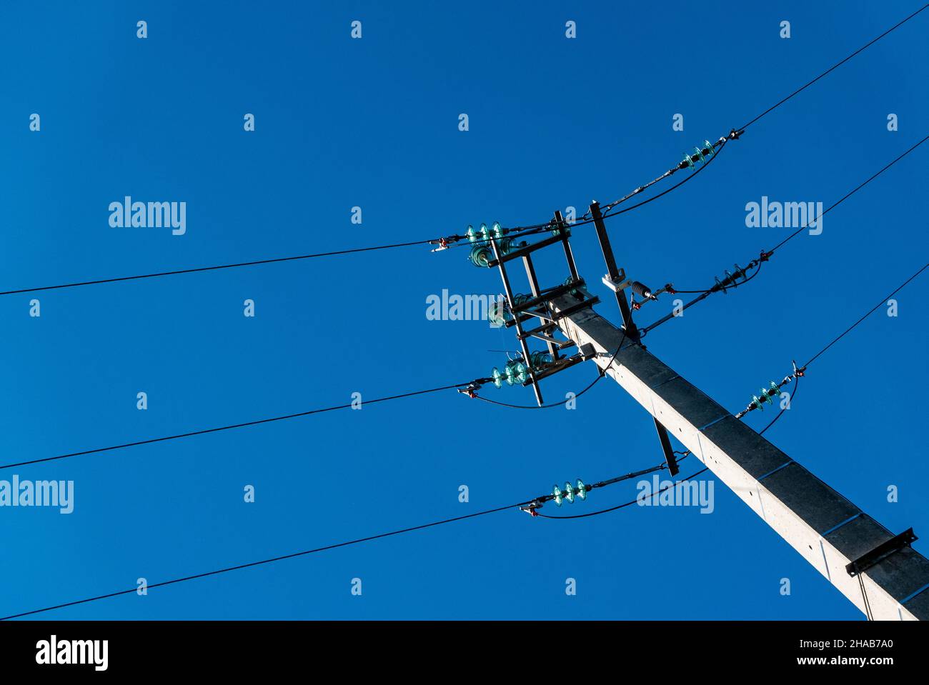 Power supply on a sky blue background Stock Photo - Alamy