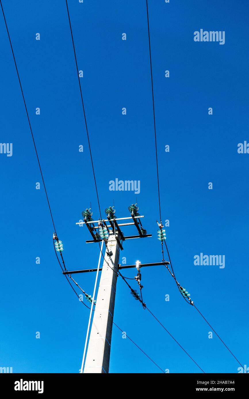Power supply on a sky blue background Stock Photo - Alamy