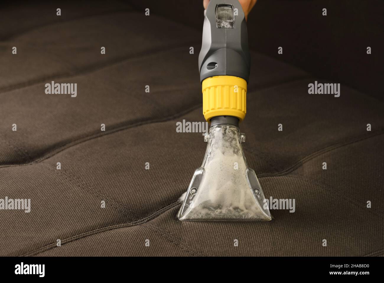 Deep professional cleaning of sofa with vaccum cleaner Stock Photo Alamy